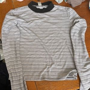 It is a tight black and white stoped shirt.